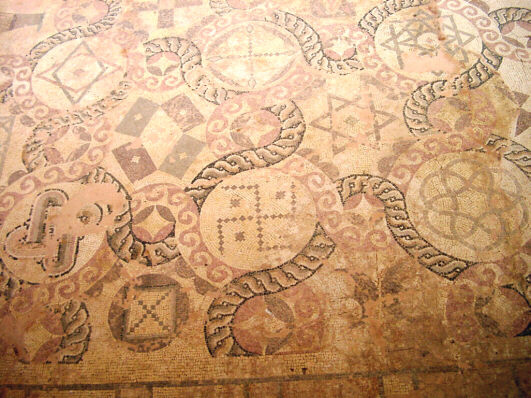 Antique floor mosaic with symbols in Dionysos' House in Paphos