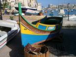 Luzzu in St. Julians' harbour